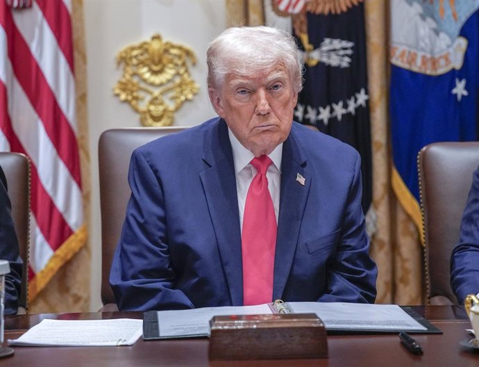 December 2, 2025, Washington, District Of Columbia, USA: United States President Donald J Trump listens as he holds a meeting with his Cabinet in the Cabinet Room of the White House in Washington, DC, USA, on Tuesday, December 2, 2025