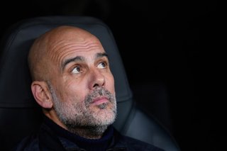 Pep Guardiola, head coach of Manchester City, looks on during the UEFA Champions League 2025/26 League Phase MD6 match between Real Madrid C.F. and Manchester City at Bernabeu stadium on December 10, 2025 in Madrid, Spain.