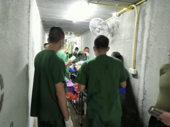 BANGKOK, Dec. 10, 2025  -- This photo provided by Royal Thai Army shows patients and staff evacuating to shelters at a hospital where rockets fired from the Cambodian side landed nearby, in Surin province, Thailand on Dec. 10, 2025. Thai Defense Ministry 