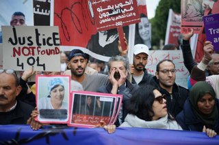 December 13, 2025, Tunis, Tunis, Tunisia, Tunisia: Protesters take part in a march organized by the Tunisian League for the Defense of Human Rights under the slogan "No chain should remain unbroken," as demonstrators move through central Tunis calling for