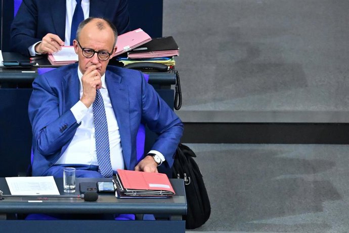 17 December 2025, Berlin: German Chancellor Friedrich Merz sits in the 49th plenary session of the 21st legislative period in the German Bundestag. Following a government questioning and the Chancellor's government statement on the EU summit taking place 