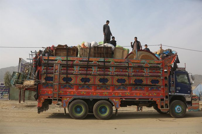 TORKHAM, Dec. 18, 2025  -- Afghan returnees are seen on a truck bound for their home province from a temporary camp at the Torkham border crossing, Afghanistan, Dec. 16, 2025. As the world marks International Migrants Day on Thursday, the unfolding narrat