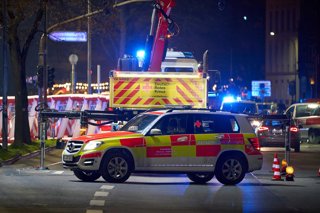 22 December 2025, Hesse, Giessen: Emergency vehicles from the German Red Cross are parked in the center of Giessen, where a car is said to have driven into a bus stop and three people are injured. Photo: Sascha Ditscher/dpa