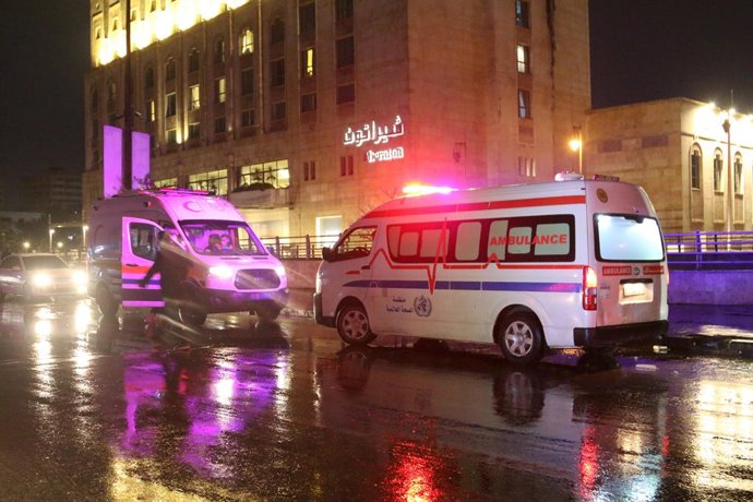 DAMASCUS, Jan. 1, 2026  -- Photo taken on early hours of Jan. 1, 2026 shows ambulances near the site of the suicide bombing in Aleppo city, northern Syria. One person was killed, and several members of Syria's internal security forces were wounded on Wedn