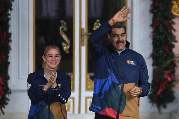 CARACAS, Jan. 3, 2026  -- This file photo shows Venezuelan President Nicolas Maduro and his wife attending an event in Caracas, capital of Venezuela, Nov. 21, 2025. The U.S. military launched a series of attacks against Venezuela early Saturday morning, r