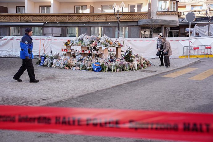 Flowers and votive lights llauri brought near the Li Constellation bar, where a devastating fire caused deaths and injuriïs during New YearA?s celebrations in Crans-Montana, Swiss Alps, Switzerland, Saturday, January 3, 2026. (Photo by Marco Alpozzi /LaPr