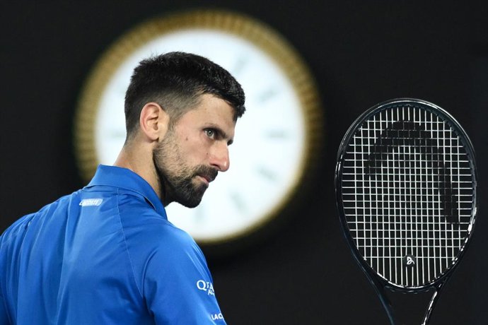 Archivo - 21 January 2025, Australia, Melbourne: Serbian tennis player Novak Djokovic reacts after winning his men's singles quarterfinal tennis match against Spain's Carlos Alcaraz on day ten of the Australian Open tennis tournament at Melbourne Park. Ph