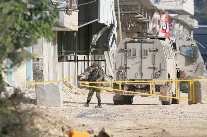 January 4, 2026, Nablus, West Bank, Palestine: An Israeli soldier closes a gate at the Nur Shams refugee camp. The Israeli army launched a large-scale military operation which is still ongoing claiming it aims to eliminate Palestinian armed groups in refu