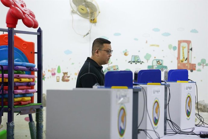 YANGON, Jan. 11, 2026  -- A man votes at a polling station during the second phase of the general election in Yangon, Myanmar, Jan. 11, 2026. Myanmar kicked off the second phase of its multi-party democratic general election on Sunday morning, with pollin