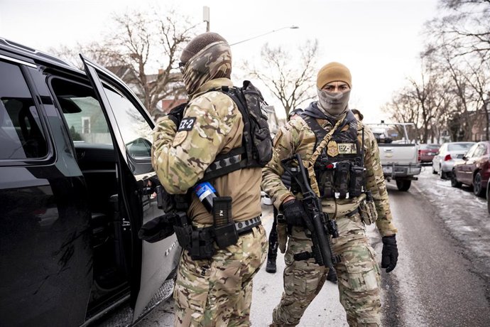 January 11, 2026, Minneapolis, Mn, United States: Federal agents looks on during a patrol in Minneapolis, Minn., on Sunday, Jan. 11, 2026.