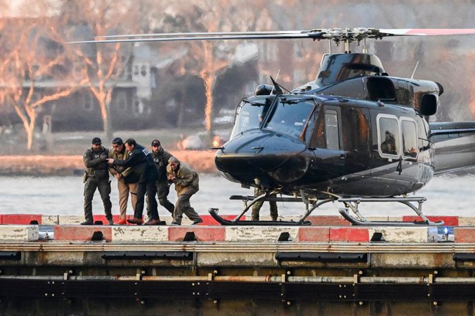 January 5, 2026, Manhattan, New York, USA: Ousted President NICOLAS MADURO of Venezuela, second right, and his wife, CILIA FLORES, second left, arrive at the Wall Street Heliport in the New York City borough of Manhattan, NY, to be transported to appear i