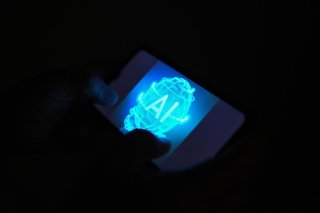 Archivo - Un móvil con las siglas AI de Artificial Intelligence (Inteligencia Artificial), a 24 de octubre de 2025, en Barcelona, Cataluña (España). Según un estudio de la Universidad Internacional de La Rioja (UNIR), España se sitúa a la cabeza del desar