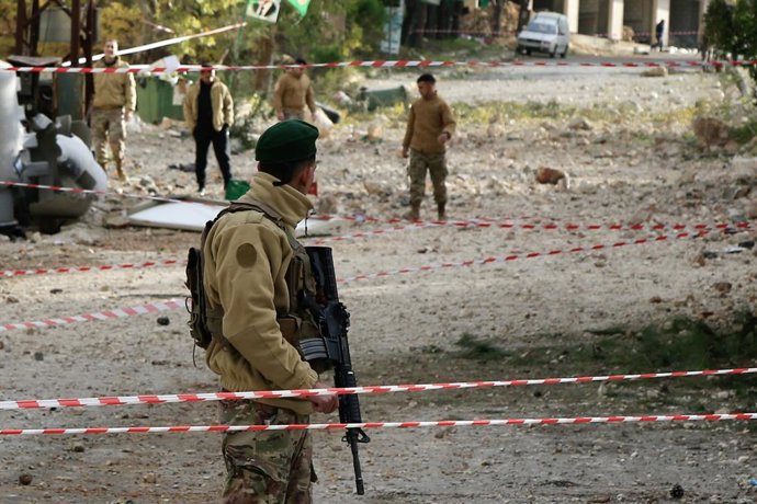KFAR HATTA, Jan. 12, 2026  -- Lebanese soldiers inspect damage to residential buildings and cars following Israeli airstrikes in Kfar Hatta, southern Lebanon, Jan. 12, 2026. The Israeli forces carried out on Sunday afternoon airstrikes on the village of K