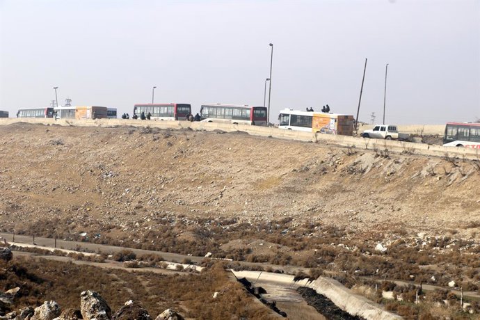 ALEPPO, Jan. 10, 2026  -- Buses to evacuate Syrian Democratic Forces (SDF) fighters who want to leave the area are seen lining up to enter the Sheikh Maqsoud neighborhood in Aleppo, northern Syria, Jan. 9, 2026. The Syrian interim government on Friday acc