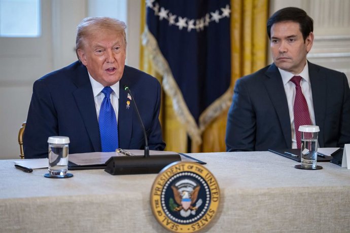 January 9, 2026, Washington, District Of Columbia, USA: United States Secretary of State Marco Rubio looks on as US President Donald J Trump speaks during a meeting with oil and gas executives in the East Room of the White House in Washington, DC, USA, on