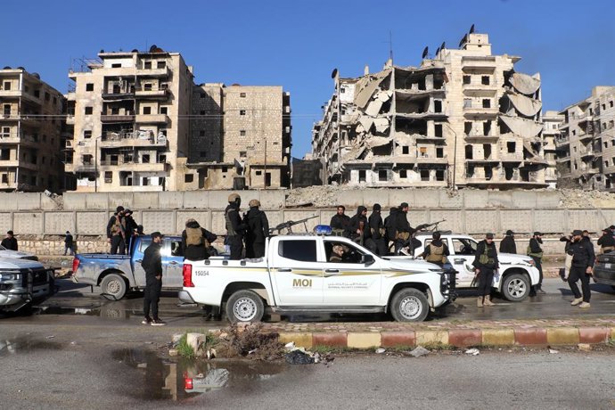 ALEPPO, Jan. 10, 2026  -- Members of Syria's internal security forces are seen deployed at the entrance of the Sheikh Maqsoud neighborhood in Aleppo, northern Syria, Jan. 10, 2026. The Syrian interim government on Friday accused the Kurdish-led Syrian Dem
