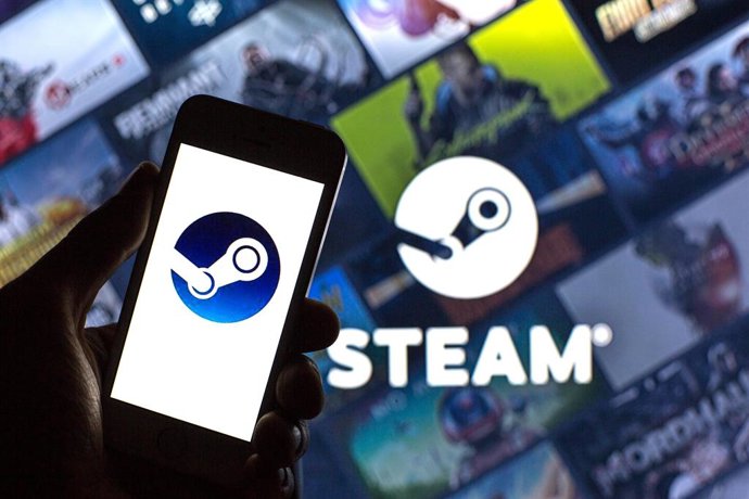Archivo - August 11, 2021, Spain: In this photo illustration, a Steam logo seen displayed on a smartphone and in the background.