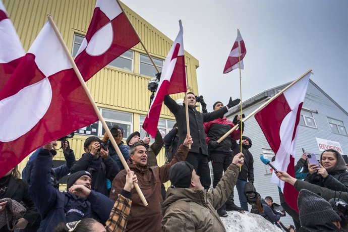 BEIJING, Jan. 18, 2026  -- Greenland's Prime Minister Jens-Frederik Nielsen (L, on the snow) is seen during a demonstration against U.S. actions and remarks suggesting control over Greenland in Nuuk, capital of Greenland, an autonomous territory of Denmar