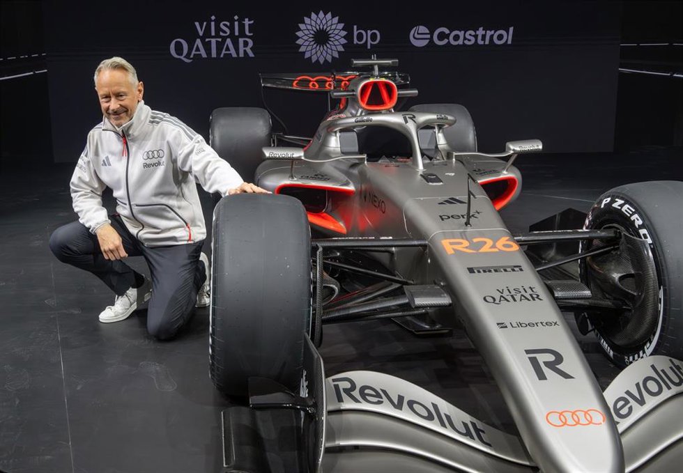 20 January 2026, Berlin: Spokesperson for the management of the Audi Revolut F1 Team Jonathan Wheatley sits next to Audi Revolut's R26 Formula 1 race car, which is being unveiled at Kraftwerk Mitte. Photo: Soeren Stache/dpa