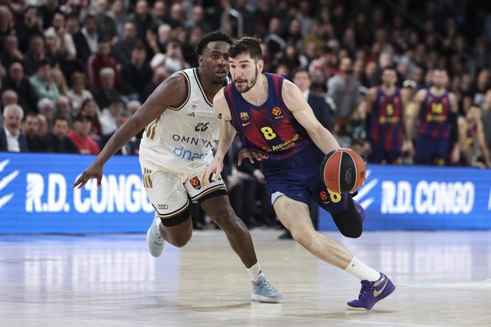 Dario Brizuela of FC Barcelona and McKinley Wright IV of Dubai Basketball in action during the EuroLeague Regular Season Round 23 match played between FC Barcelona and Dubai Basketball at Palau Blaugrana on January 20, 2026 in Barcelona, Spain.