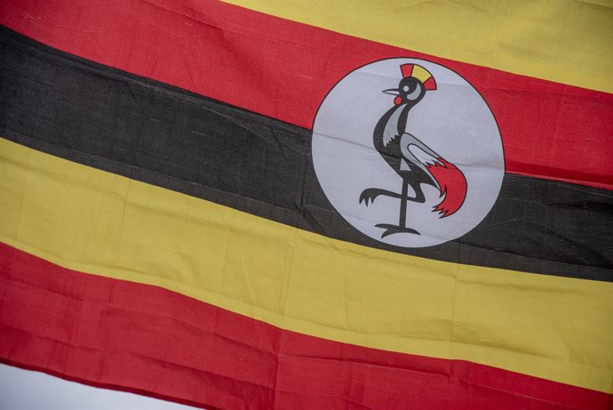 January 21, 2026, London, United Kingdom: A Ugandan flag flies during the demonstration outside the Parliament in London. A group of activists from the People Power, Our Power movement protested outside the Parliament in London. The People Power, Our Powe