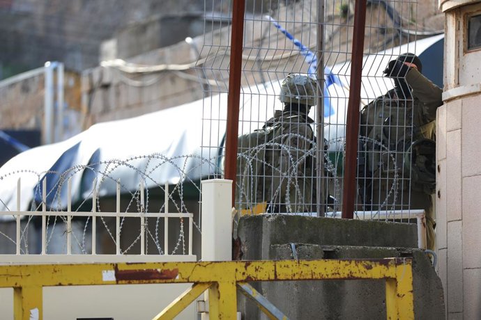 January 10, 2026, Hebron, West Bank, Palestinian Territory: Israeli soldiers stand guard during a weekly settlers' tour in Hebron, in the Israeli-occupied West Bank, January 10, 2026