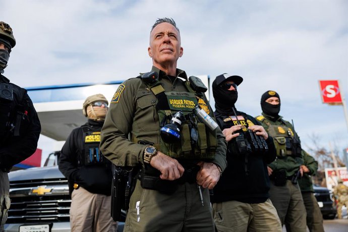 December 17, 2025, Chicago, Il - Illinois, USA - United States: People yell at U.S. Border Patrol Cmdr. Gregory Bovino and other agents while they stop at a gas station while conducting an immigration enforcement action, Dec. 17, 2025 in Evanston, Illinoi