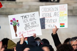 January 24, 2026, London, United Kingdom: Protesters hold placards saying ''They cut hor, hair, not her resistance'' and ''Children in Kobane are starving'' during the demonstration. Kurdish demonstrators gathered in Trafalgar Square in London to protest 