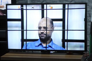 Archivo - TRIPOLI, April 27, 2014  Saif al-Islam, Gaddafi's second son, is questioned via videoconference software in court in Tripoli, Libya, April 27, 2014. A Libyan court on Sunday continued the trial of the dozens of senior figures of former Libyan le