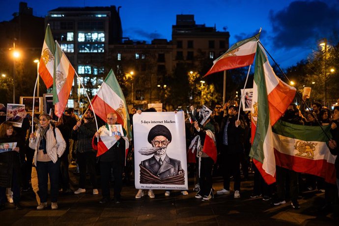 January 13, 2026, Barcelona, Barcelona, Spain: Demonstrators gathered in downtown Barcelona to show their solidarity with the ongoing protests in Iran. Approximately 100 people denounced human rights violations and championed the slogan ''Woman, Life, Fre