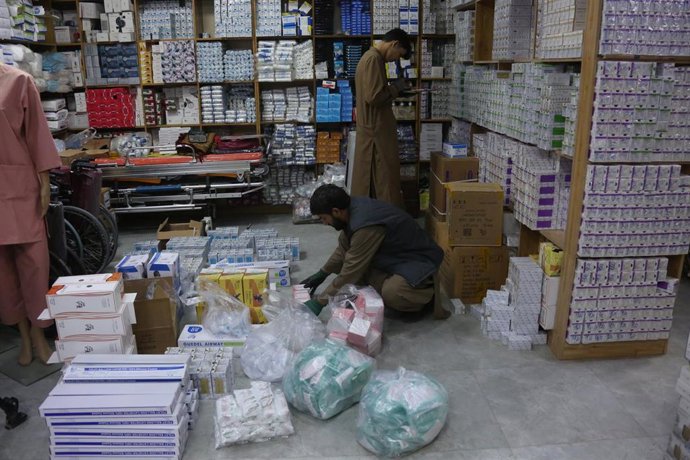 KABUL, Jan. 13, 2026  -- Staff members arrange medicines at a pharmacy in Kabul, Afghanistan, Jan. 5, 2026. TO GO WITH "Feature: Chinese medicines emerge as a bridge of health amid Afghanistan's healthcare struggles"