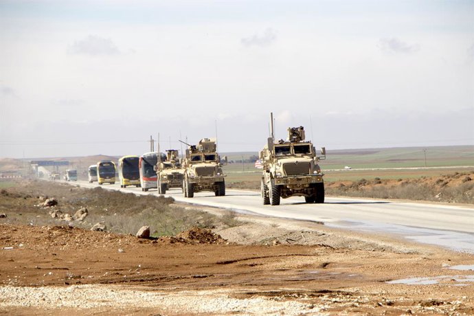 HASAKAH, Feb. 8, 2026  -- U.S. military vehicles escort passenger buses transporting Islamic State (IS) detainees from northeastern Syria into Iraq on Feb. 8, 2026. Iraq has received 2,250 IS terrorist detainees from Syria and commenced legal classificati