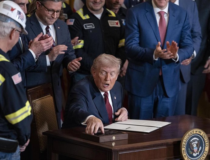 February 11, 2026, Washington, District Of Columbia, USA: United States President Donald Trump signs an executive order alongside coal workers and U.S. Secretary of the Interior Doug Burgum and Speaker of the House Mike Johnson (R-LA) during an event on t