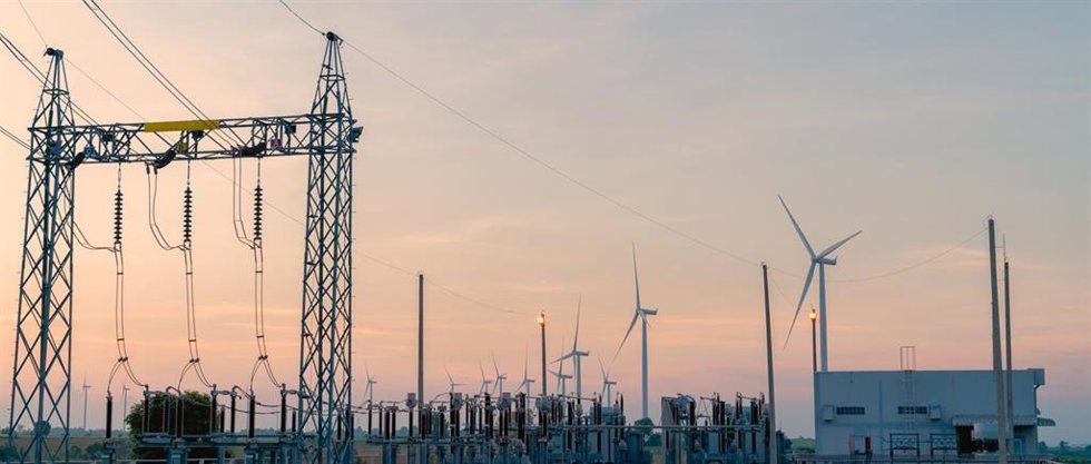 Archivo - Wind turbines generate electricity. Electric current redistribution substation. Clean and Renewable energy concept.