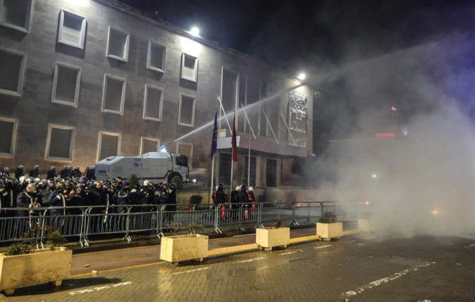 February 10, 2026, Tirana, Tirana, Albania: Albanian police are seen behind crowd control barriers as petrol bomb are thrown in front of the Prime Minister's office   from protesters gathered in Tirana, Albania on 10 February 2026. The demonstration organ