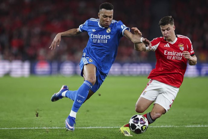 Kylian Mbappe of Real Madrid CF and Samuel Dahl of SL Benfica in action during the UEFA Champions League 2025/26 League Knockout Play-off First Leg match between SL Benfica and Real Madrid C.F. at Estadio do SL Benfica on February 17, 2026 in Lisbon, Port