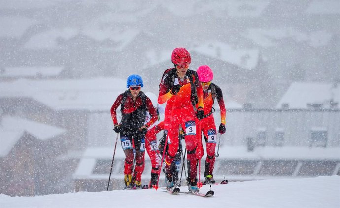 19 February 2026, Italy, Bormio: (L-R) Cidan Yuzhen of Team China, Ana Alonso Rodriguez of Team Spain and Maria Costa Diez of Team Spain compete on the ascent during the women's sprint qualification in ski mountaineering at the Milano Cortina 2026 Winter 