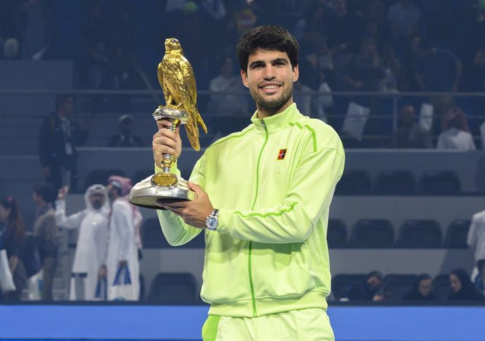 DOHA, Feb. 22, 2026  -- Champion Carlos Alcaraz poses with the trophy during the awarding ceremony after the men's singles final match between Carlos Alcaraz of Spain and Arthur Fils of France at the ATP Qatar Open 2026 tennis tournament final in Doha, Qa