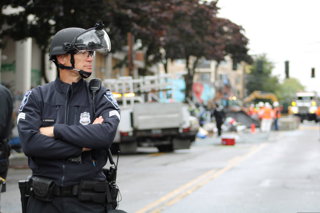 01 July 2020, US, Seattle: A police officer stands guard at an almost empty street following the Seattle's mayor Jenny Durkan order to end up all kinds of protests and demonstrations which led to the arrest at least 20 people.