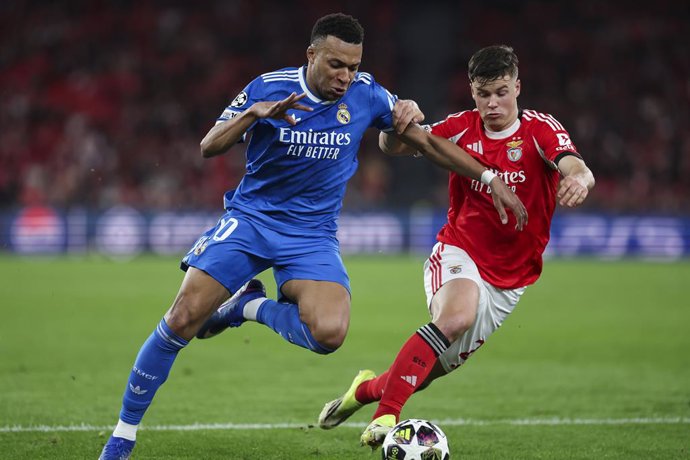 Kylian Mbappe of Real Madrid CF and Samuel Dahl of SL Benfica in action during the UEFA Champions League 2025/26 League Knockout Play-off First Leg match between SL Benfica and Real Madrid C.F. at Estadio do SL Benfica on February 17, 2026 in Lisbon, Port
