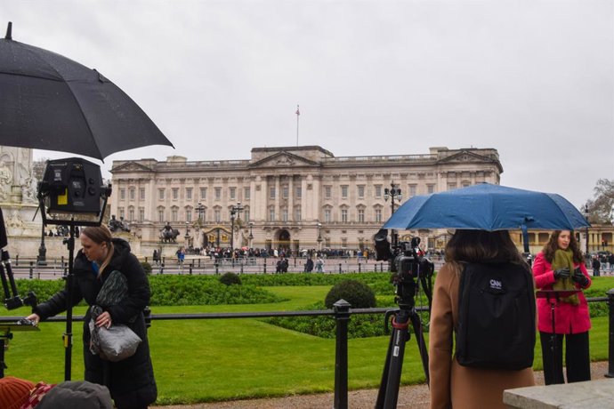 February 20, 2026, London, England, United Kingdom: Members of the media gather outside Buckingham Palace as Andrew Mountbatten-Windsor, formerly Prince Andrew, is released following his arrest on suspicion of misconduct in public office following revelat