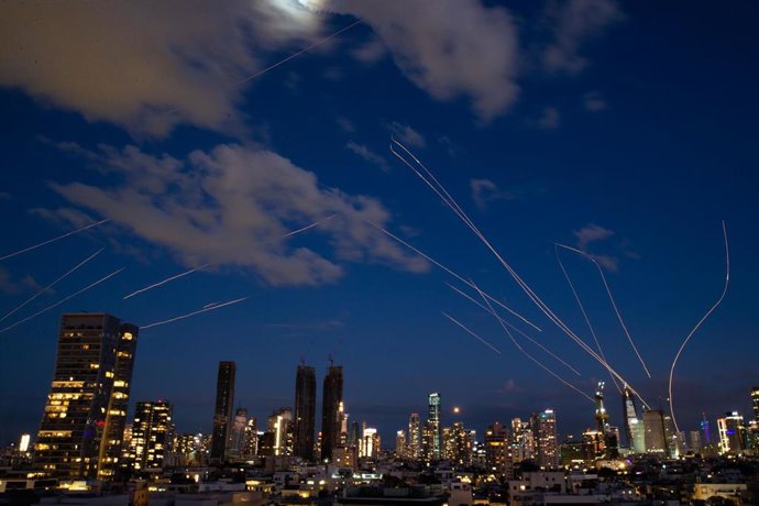 TEL AVIV, March 1, 2026  -- This long exposure photo taken on Feb. 28, 2026 shows flare trails of the interceptor missiles launched from Israeli air defense systems in Tel Aviv, Israel. The United States and Israel on Saturday launched "major combat opera