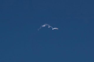 TEL AVIV, March 1, 2026  -- This photo taken on Feb. 28, 2026 shows smoke trails left by interceptor missiles launched from Israeli air defense systems in Tel Aviv, Israel. The United States and Israel on Saturday launched "major combat operations" agains