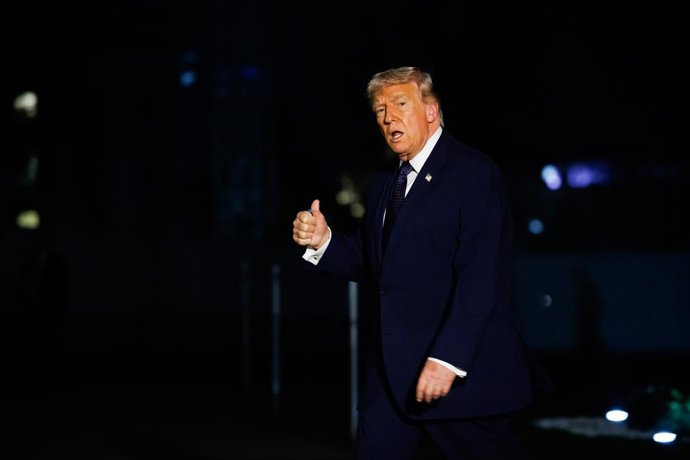 March 9, 2026, Washington, District Of Columbia, USA: United States President Donald J Trump gestures to the media as he walks on the South Lawn of the White House in Washington, DC, USA, after landing aboard Marine One on Monday, March 9, 2026. The Presi