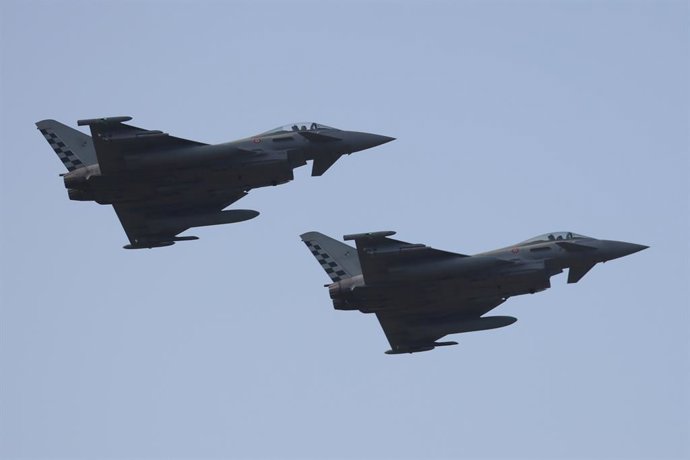 11 March 2026, Italy, Cinisi: Two Eurofighter Typhoon jets perform a low-altitude flyover at Falcone-Borsellino Airport in Cinisi. Photo: Mattia Torretta/IPA via ZUMA Press/dpa