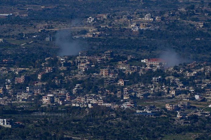KIRYAT SHMONA, March 9, 2026  -- Smoke rises from southern Lebanon following Israeli strikes, as seen from northern Israel, on March 8, 2026. Hezbollah fired missiles and drones at Israel on Monday, retaliating for the killing of Iran's Supreme Leader Ali