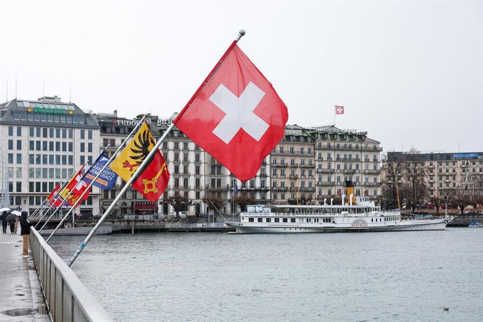 SWITZERLAND, GENEVA - FEBRUARY 19, 2026: Flags are seen over Lake Geneva