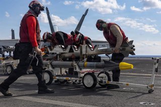 March 3, 2026, Uss Gerald R Ford, International Waters: U.S. Navy sailors prepare ordnance for loading during mission preparation on the flight deck of the Ford-class aircraft carrier USS Gerald R. Ford operating in support of Operation Epic Fury, March 2