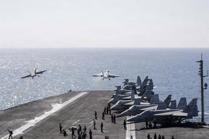 March 16, 2026, Undisclosed Location, United States: Two U.S. Navy F/A-18 Super Hornet fighters, launch off the flight deck of the Nimitz-class aircraft carrier USS Abraham Lincoln during Operation Epic Fury, March 3, 2026, from an undisclosed location.
