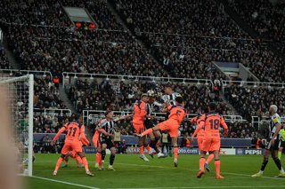 March 10, 2026, Newcastle, Newcastle, United Kingdom: 10th March 2026; St James Park, Newcastle, England; UEFA Champions League Football, Newcastle United versus Barcelona; Dan Burn of Newcastle United and Ronald Araujo of Barcelona challenge for a header